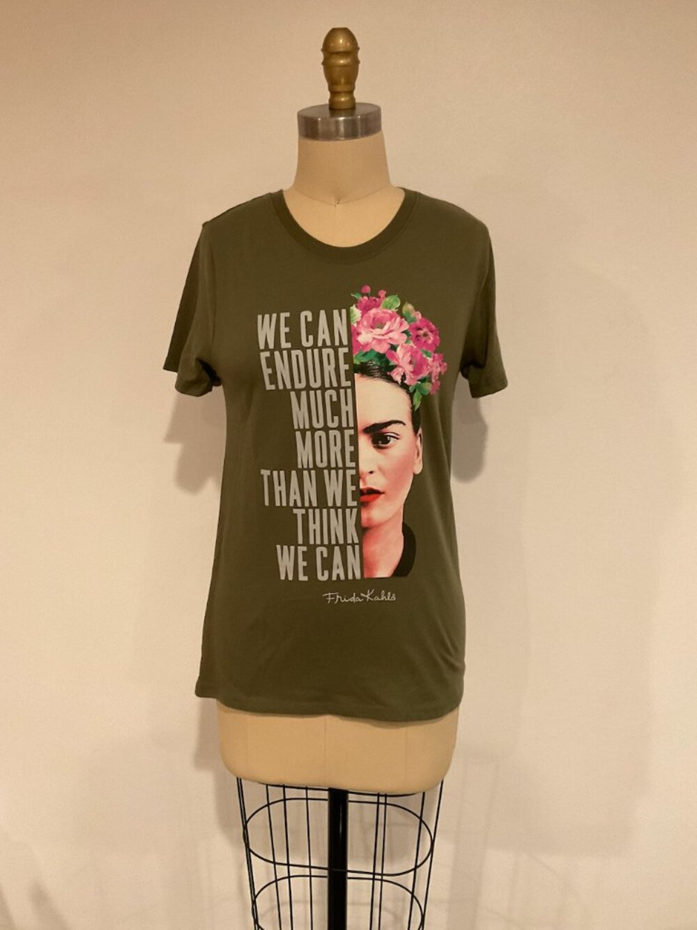 Frida Kahlo graphic T-shirt by Isaac Morris Limited featuring a colorful floral